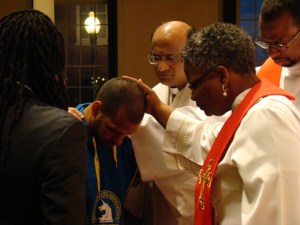 Bishop Devadhar and others pray with Stan Smith, a member of Union UMC who was running the Boston Marathon when the explosions happened. Photo & Article by Alexx Wood http://www.neumc.org/news/detail/773